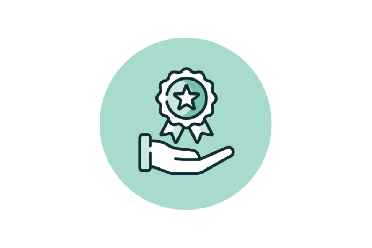 Hand holding a star ribbon badge, symbolising recognition and excellence.